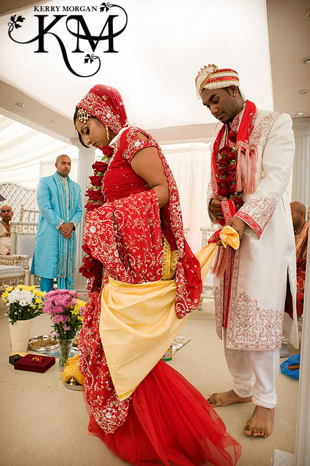 Another step of the wedding is the Pratigna Karan the couple walk around 